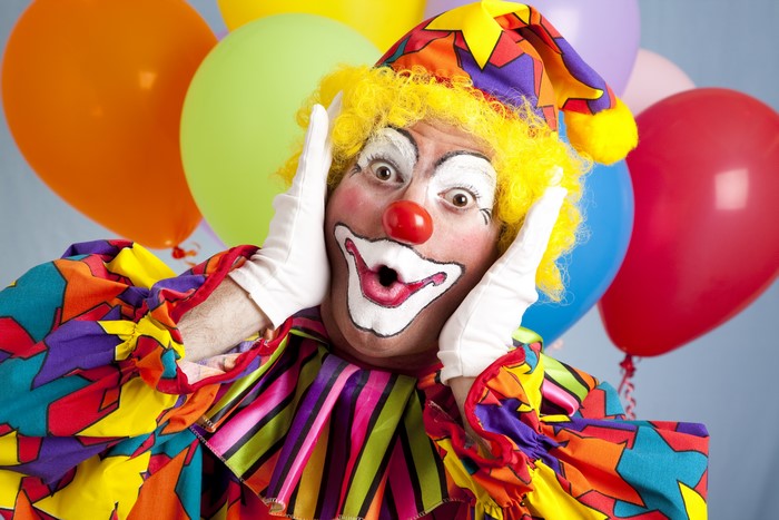 Clown with yellow wig and colorful costume