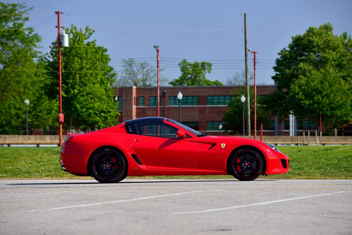 Red Ferrari SA Aperta parked on asphalt