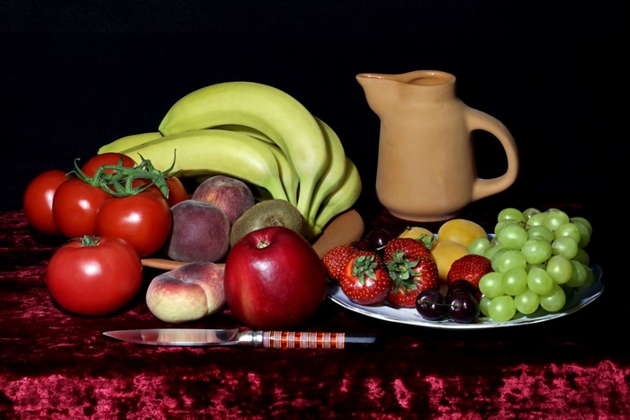 Still life with fruits, vegetables, knife, and jug