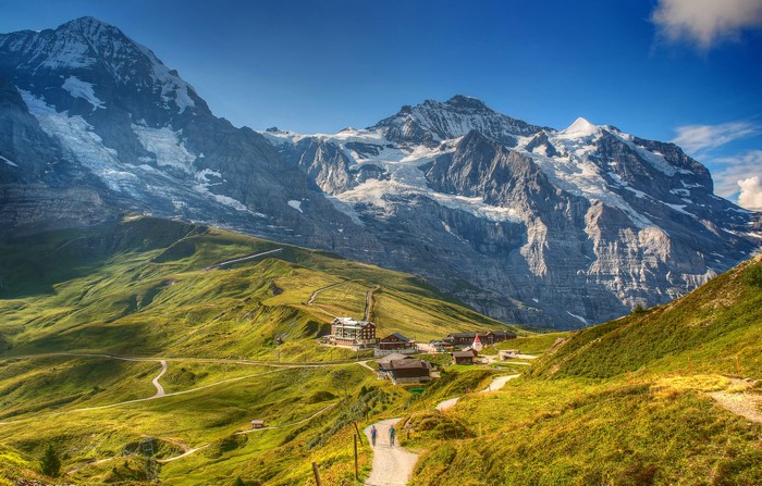 Mountain village with snow-capped Alps in Switzerland