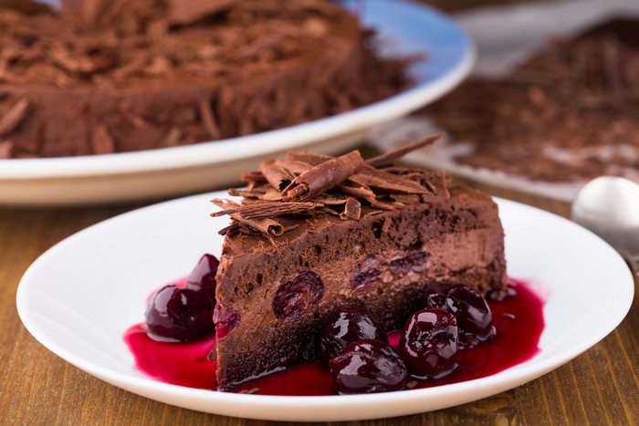 Chocolate cake with cherries and chocolate shavings