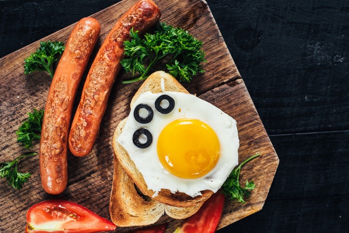 Vienna sausages with fried egg on toast