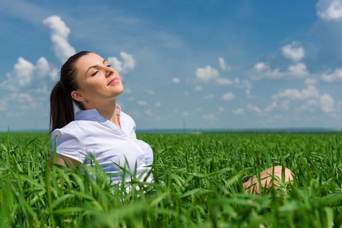 Woman in white shirt in a field