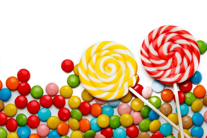 Colorful lollipops and candies on a white background