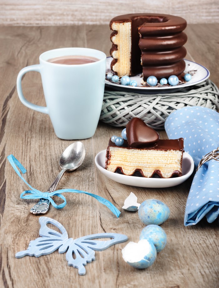 Chocolate cake with hot chocolate and Easter decorations