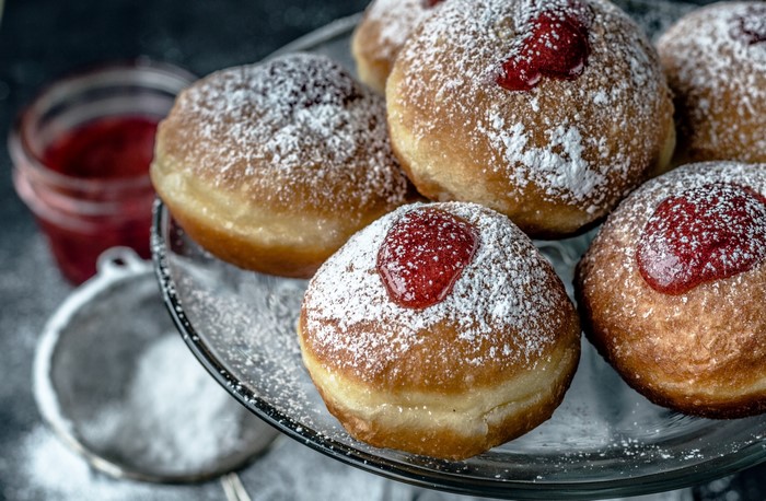 Donuts with powdered sugar and jam