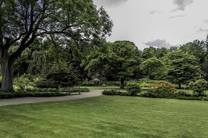 Park with trees, lawn, and a gazebo