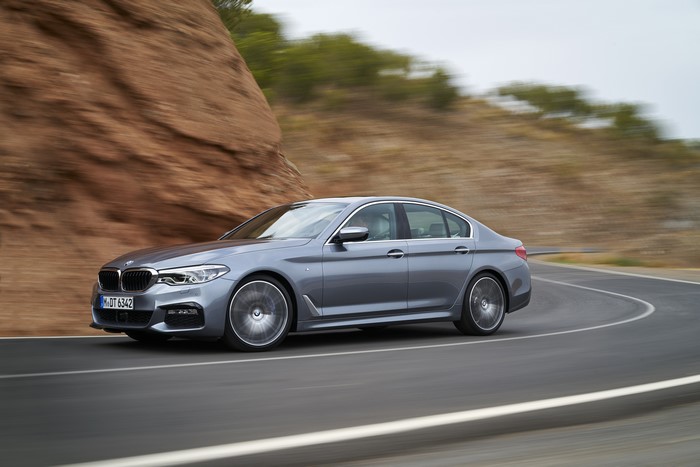 Grey BMW 5-series G30 540i Sedan in Motion