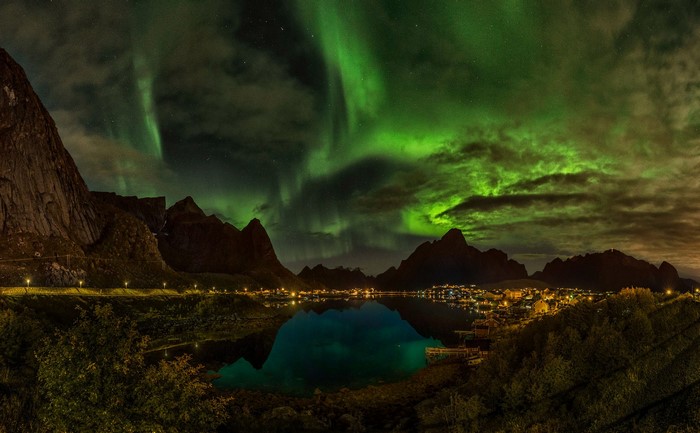 Aurora Borealis over Reine, Norway mountains and lake