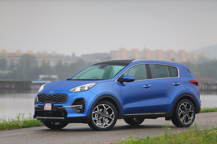 Blue 2018 Kia Sportage GT Line S parked by a lake