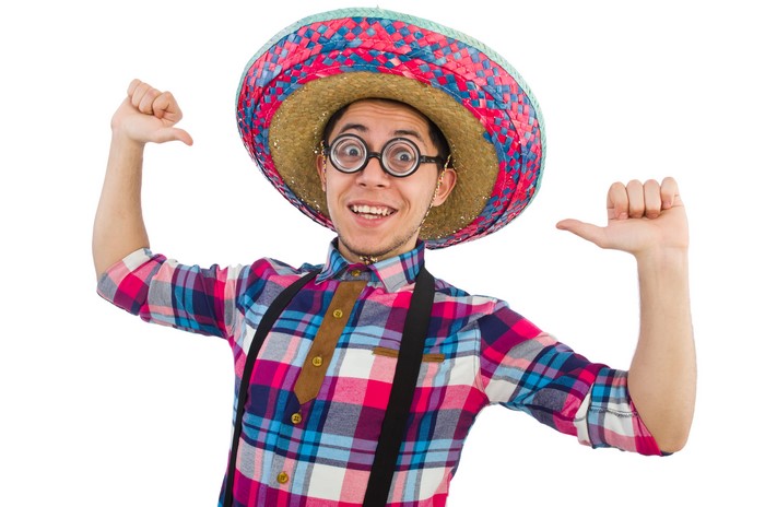 Man in sombrero and glasses with plaid shirt