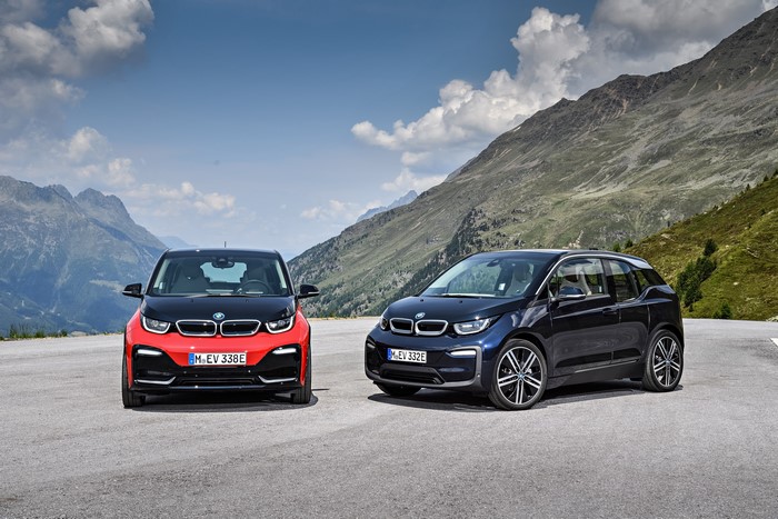 Two BMW i3 cars in mountains