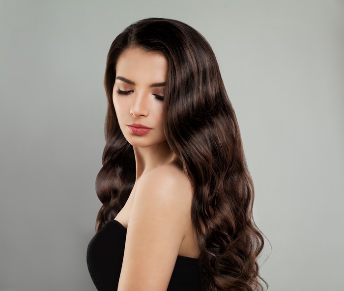 Brown haired woman with wavy hair