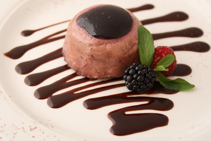 Dessert with berries and chocolate sauce