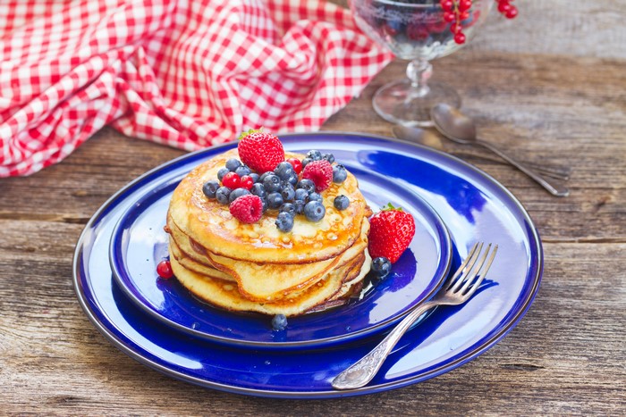 Pancakes with Berries on Blue Plate