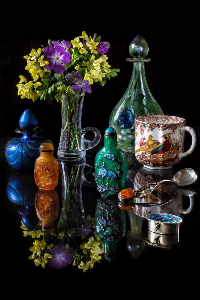 Still-life with flowers, bottles, cup, and spoon