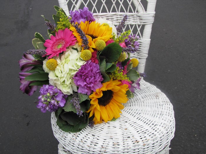 Bouquet of Gerbera, Sunflowers, Hydrangea, and Matthiola on a Chair