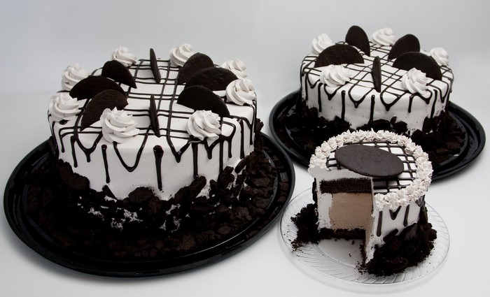 Three Oreo Cakes with Chocolate Drizzle and Whipped Cream