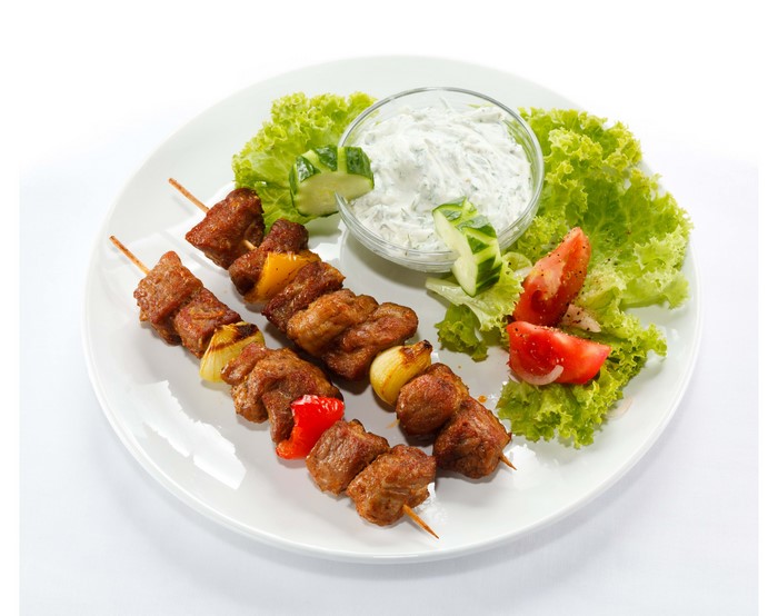 Shashlik with Tzatziki and Salad on a White Plate