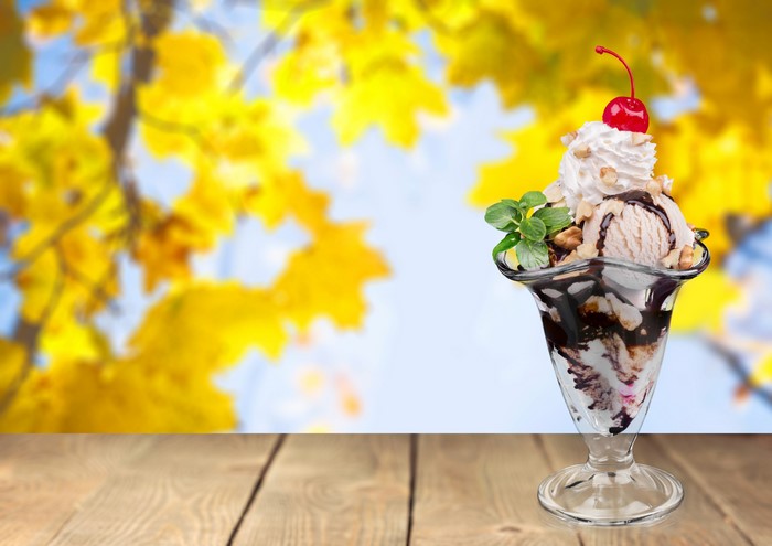 Ice cream sundae with cherry and whipped cream