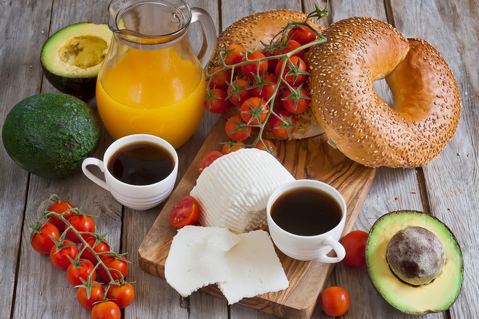 Breakfast with Coffee, Juice, Bagels, Cheese, and Avocado