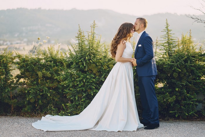 Bride and Groom kissing outdoors