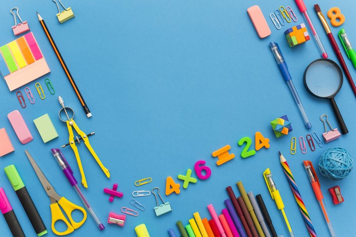 School Supplies and Math Equation on Blue Background