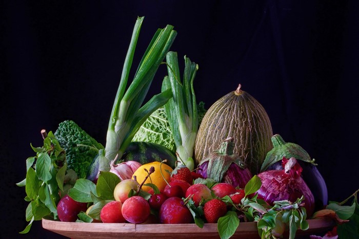 Still life of fruits and vegetables in a bowl