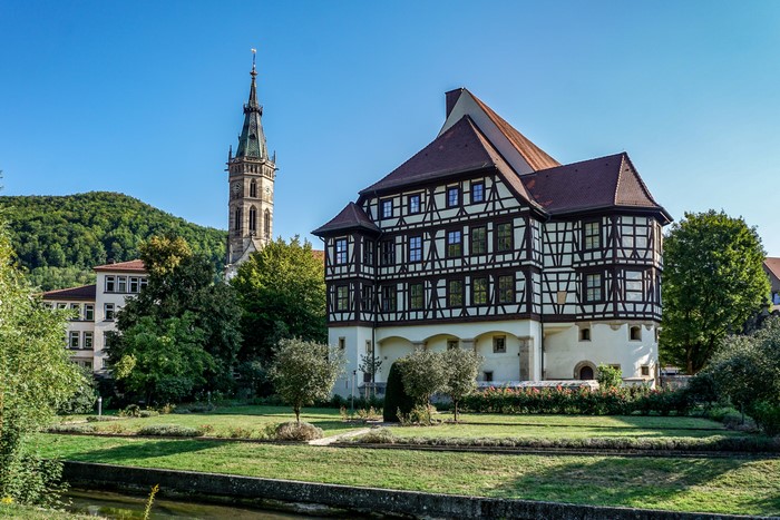 Half-timbered house and church tower in Bad Urach, Germany