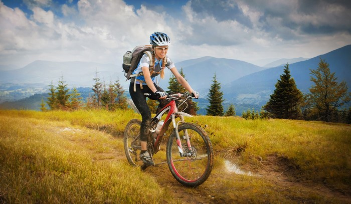 Woman riding a mountain bike on a trail