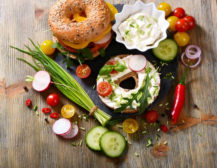 Bagels with cream cheese and vegetables