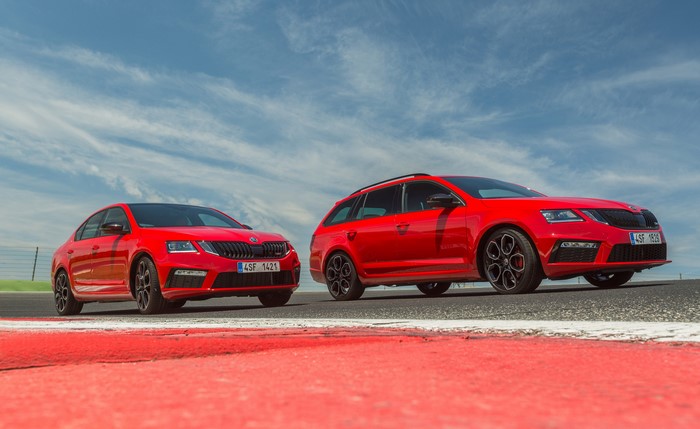 Two red Skoda Octavia cars on a track