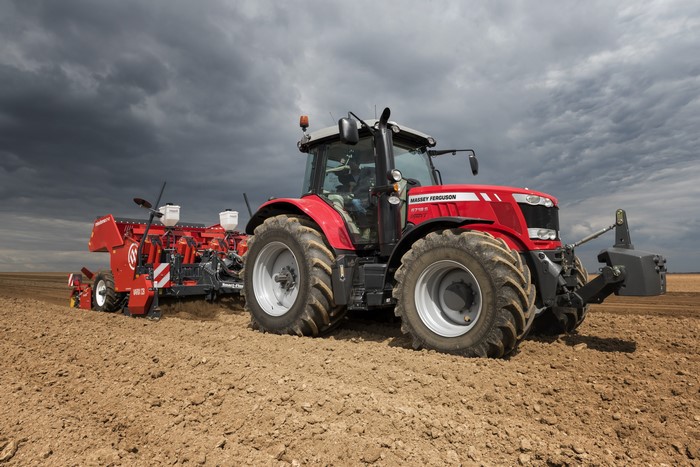 Massey Ferguson 6718 S tractor plowing a field
