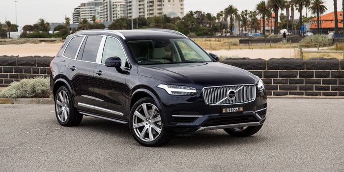 Black Volvo XC90 SUV parked by the beach