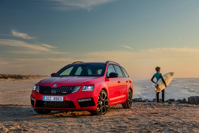 Red Skoda Octavia RS 245 Combi on Beach with Surfer