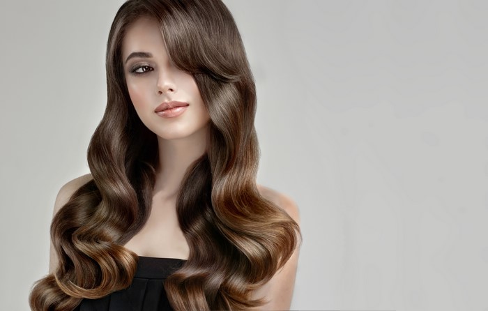 Beautiful woman with brown wavy hair