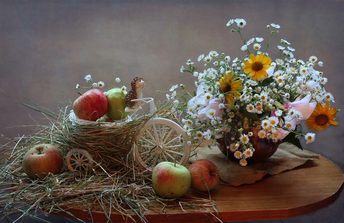 Still-life with apples, flowers, and hedgehog figurine