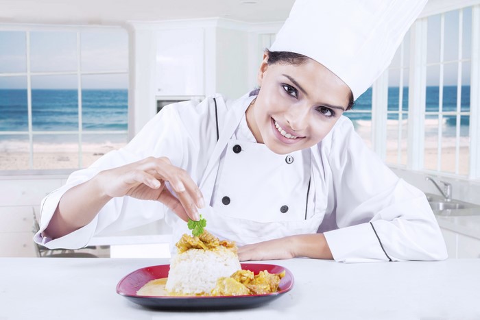 Chef garnishing a dish
