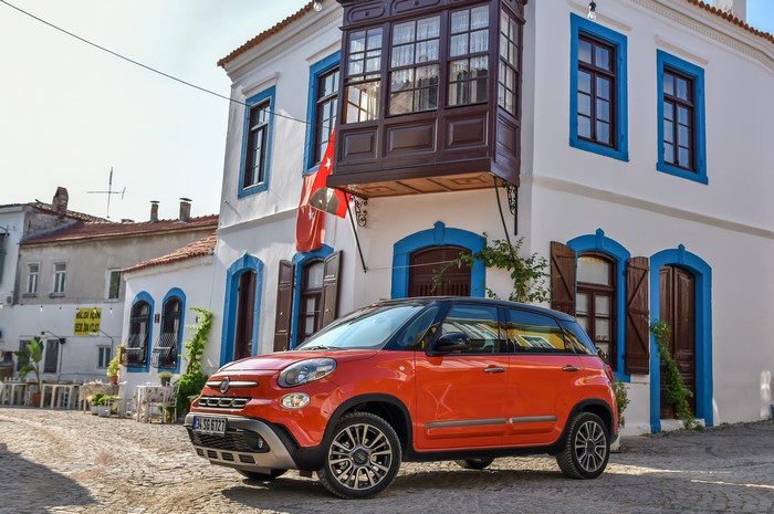 Orange Fiat 500L Cross parked in a European town