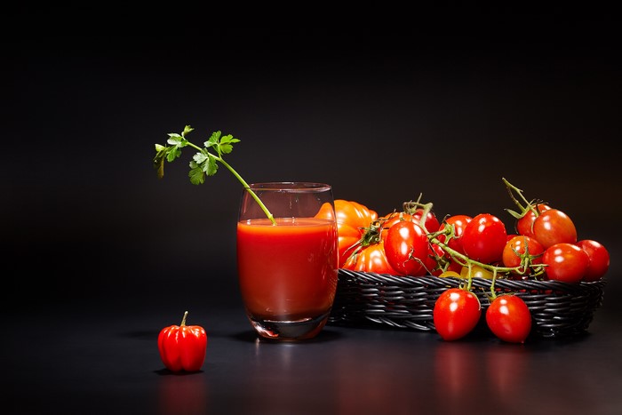 Tomatoes and Tomato Juice in Wicker Basket