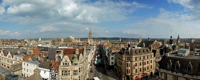 Oxford, United Kingdom cityscape with historic buildings and street