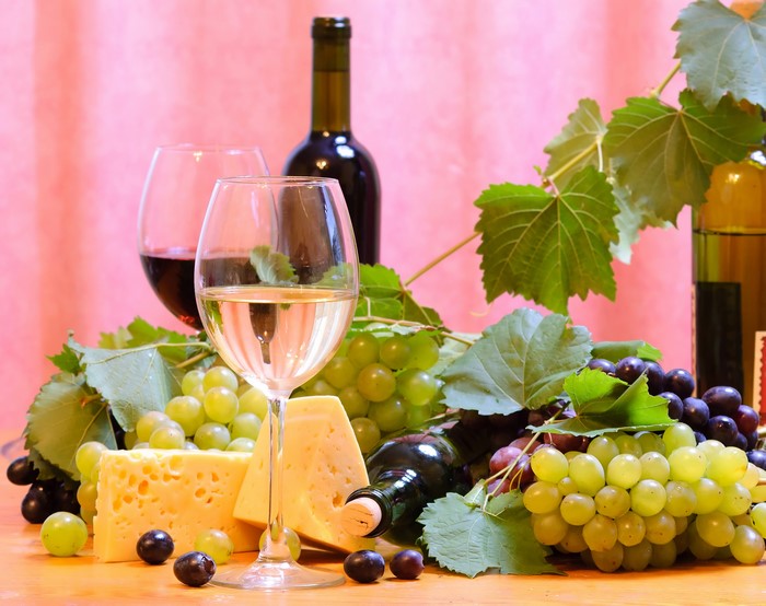 Still-life with wine, grapes, and cheese