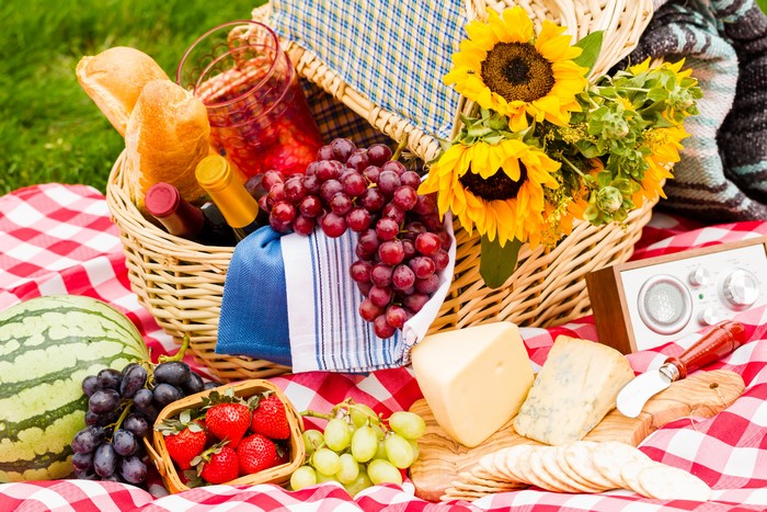 Picnic with Sunflowers, Grapes, Cheese, and Watermelon