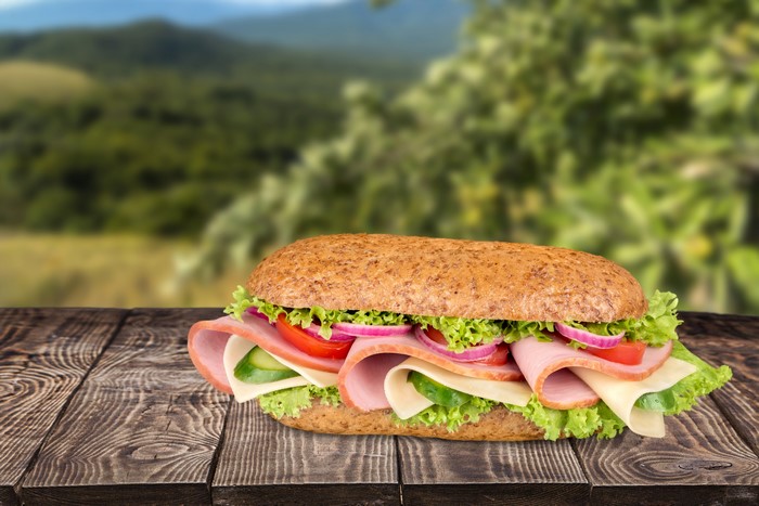 Sandwich on wood planks with blurred background