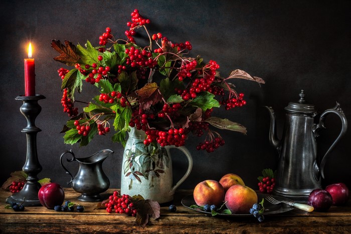 Still-life with berries, fruits, candle, and pewterware