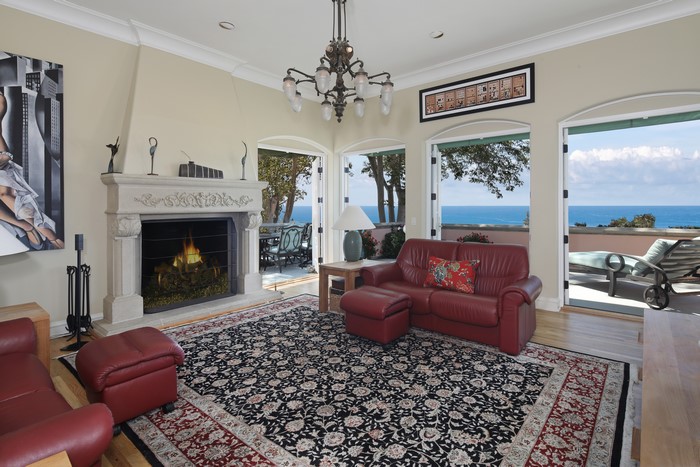 Living room with fireplace and ocean view