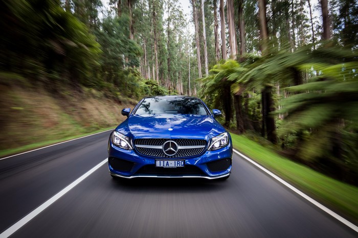 Blue Mercedes-Benz AMG C-Class Coupe on a Forest Road