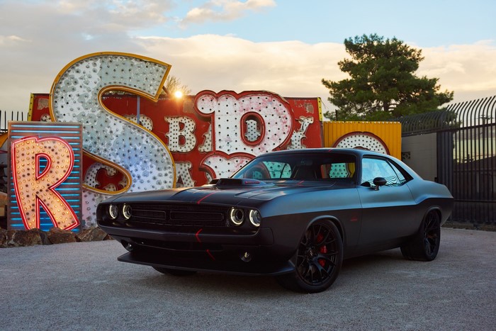 Black Dodge Challenger with Neon Signs