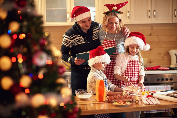 Family baking Christmas cookies in the kitchen