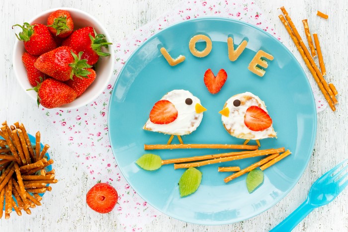 Valentine's Day breakfast with strawberry birds and love letters